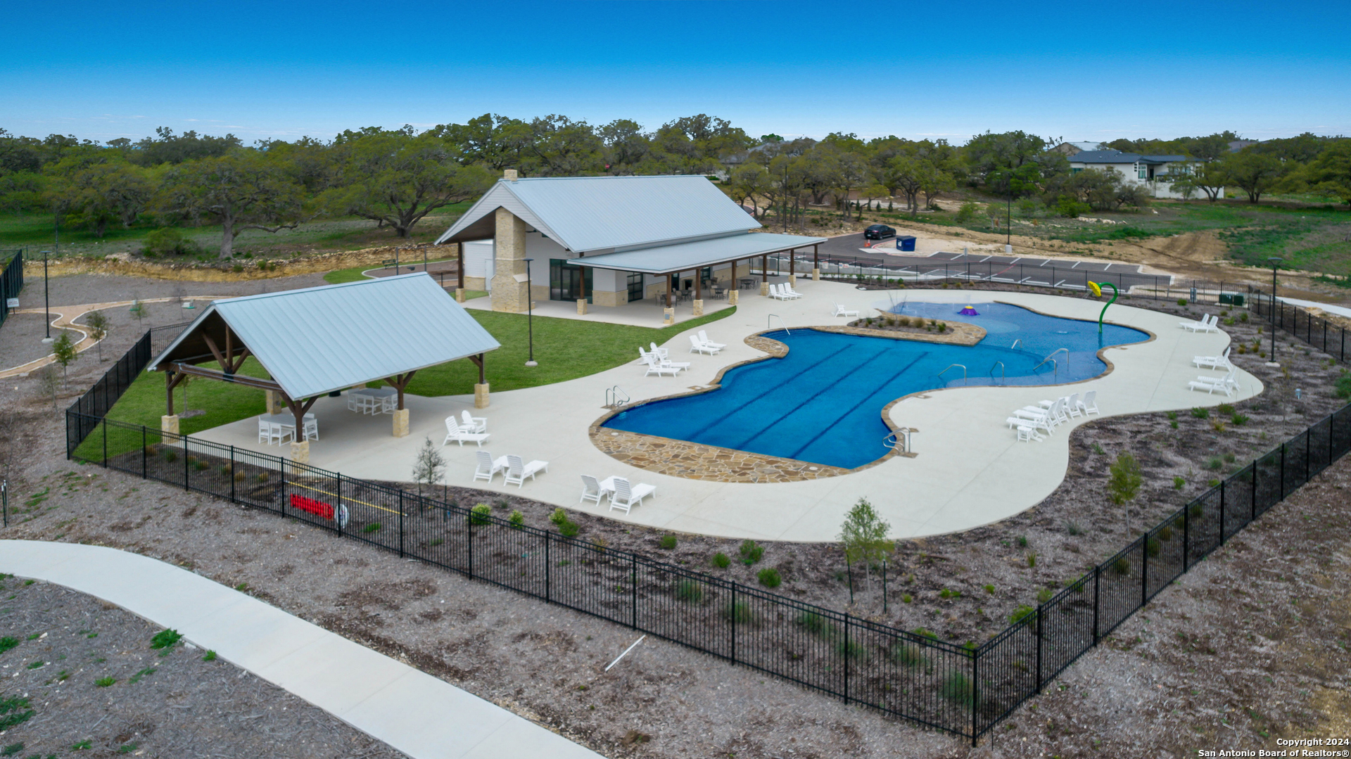 718 Post Oak Ridge Way Bulverde, TX 78163 - Photo 57 of 60 a view of a house with pool and a yard