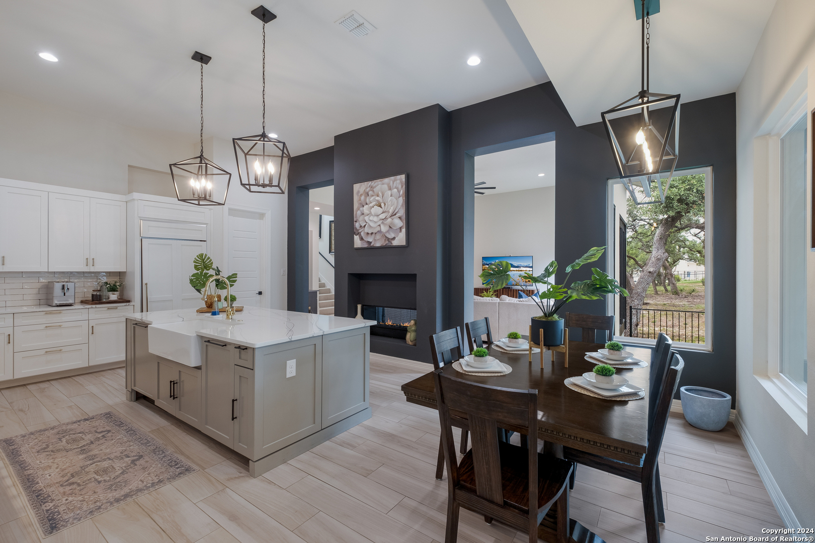 718 Post Oak Ridge Way Bulverde, TX 78163 - Photo 6 of 60 a living room with fireplace furniture and a chandelier