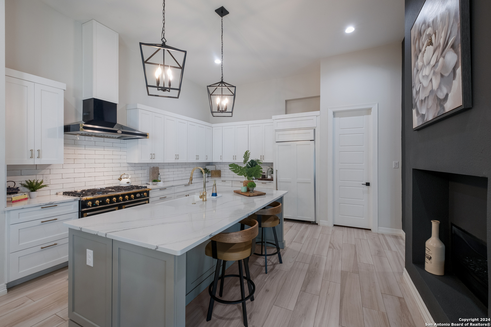 718 Post Oak Ridge Way Bulverde, TX 78163 - Photo 9 of 60 a kitchen with stainless steel appliances a stove a sink a microwave a refrigerator and cabinets