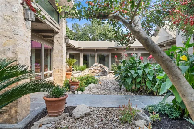 a bathroom with a sink mirror and vanity