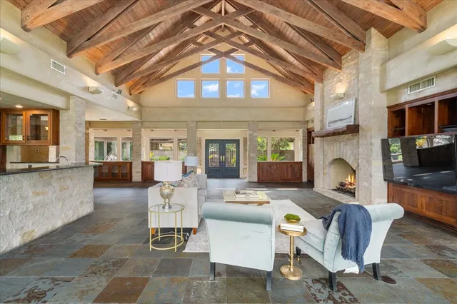 a front view of a house with potted plants