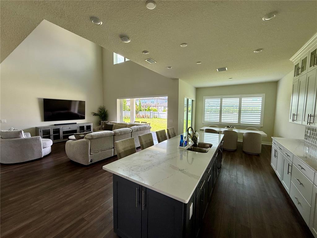 8441 Pk Clf Way Orlando, FL 32836 - Photo 17 of 59 a living room with furniture and a flat screen tv