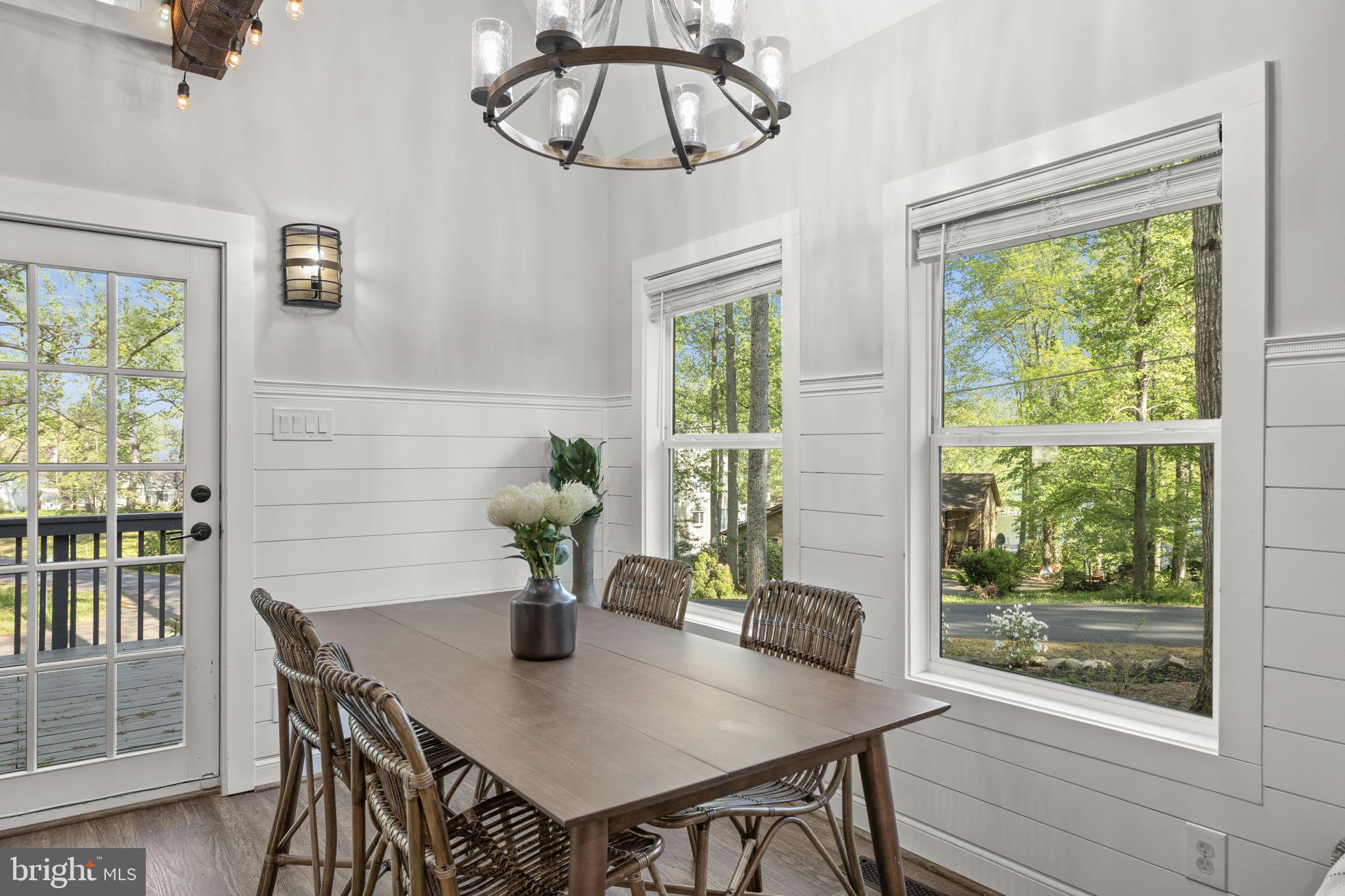 151 Harrison Circle Locust Grove, VA 22508 - Photo 20 of 83 a view of a dining room with furniture window and wooden floor