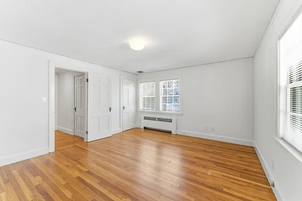 a view of entryway with stairs and wooden floor