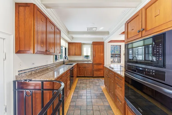 a kitchen with stainless steel appliances granite countertop a stove and a sink