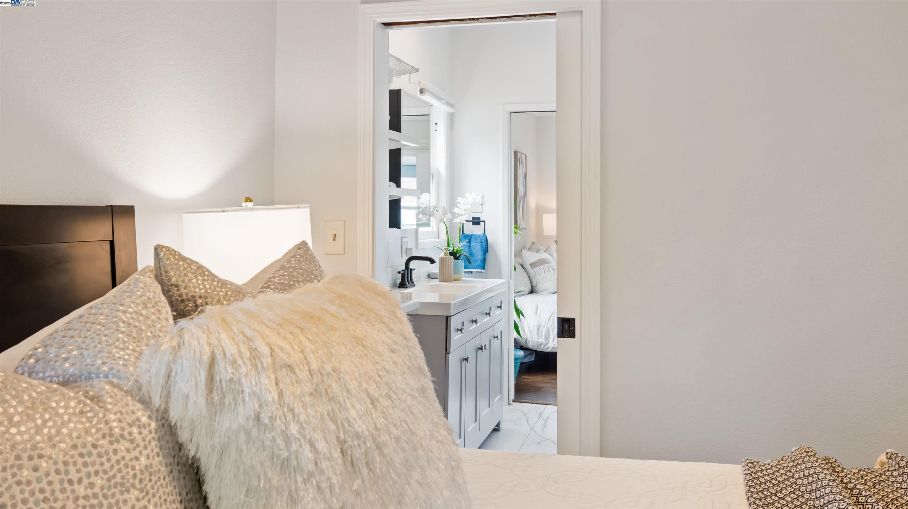 830 Buena Vista Avenue Alameda, CA 94501 - Photo 17 of 28 a bedroom with a bed and a mirror