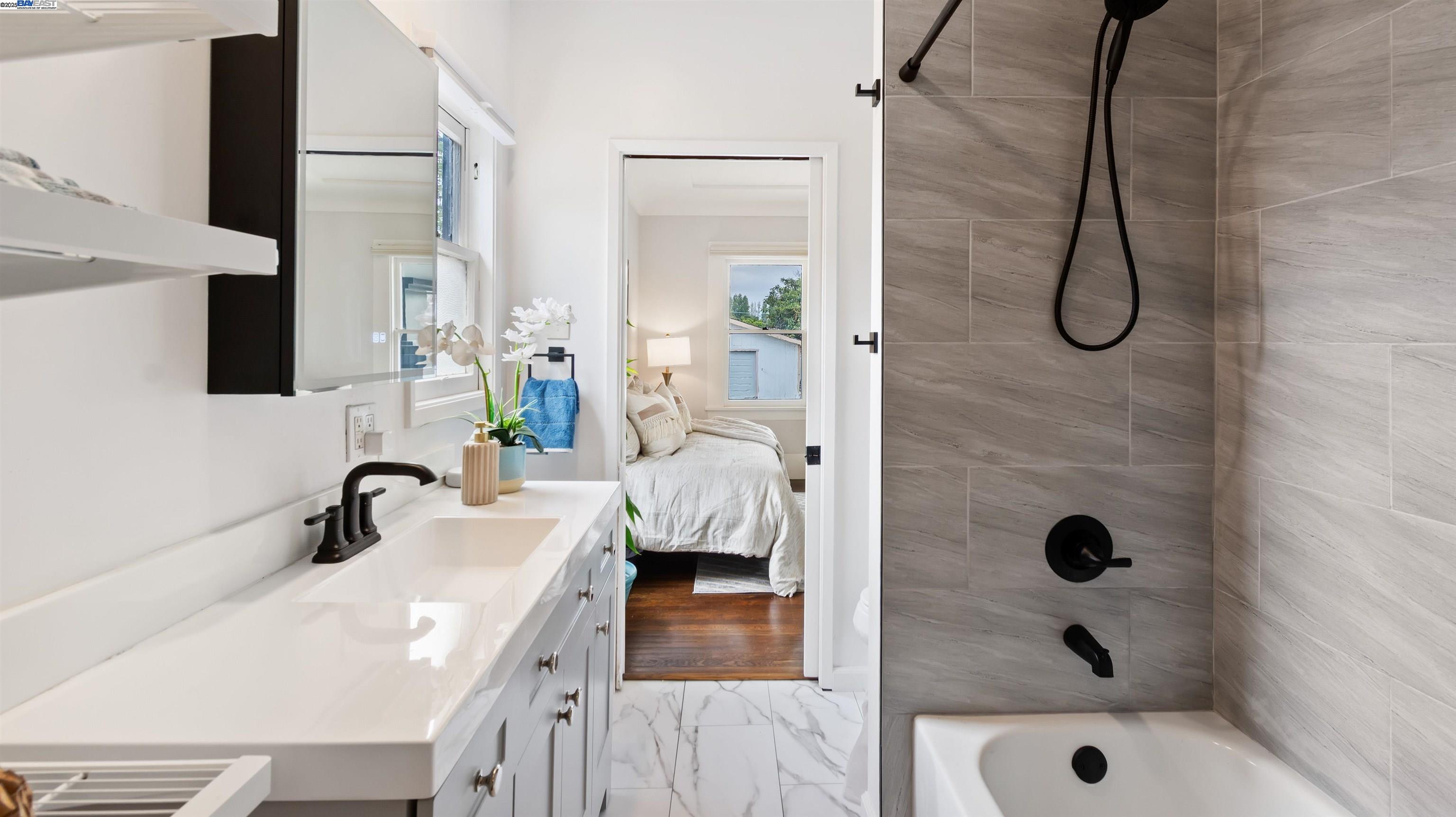 830 Buena Vista Avenue Alameda, CA 94501 - Photo 18 of 28 a bathroom with a tub sink and mirror