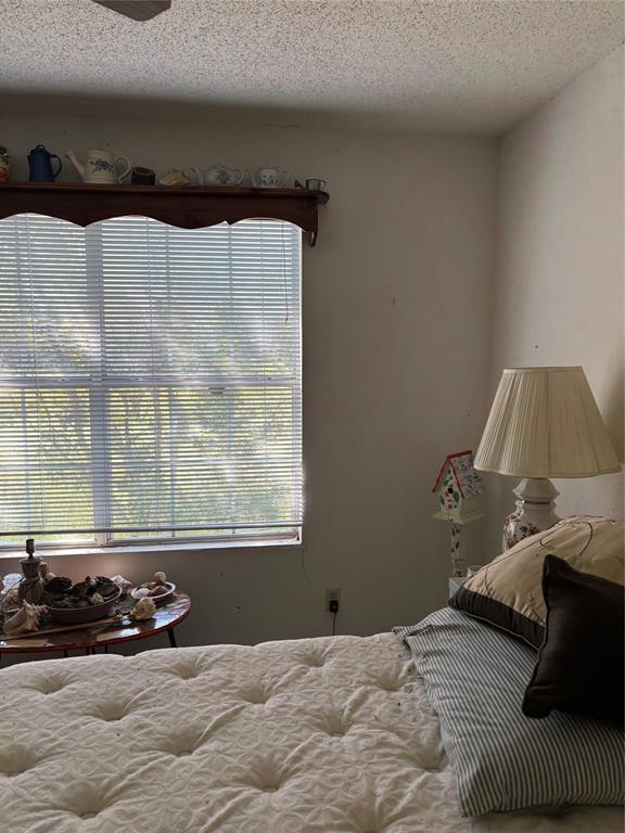 10236 County Road 2326, Unit TRACT 1 Terrell, TX 75160 - Photo 11 of 19 a bedroom with a bed and a window