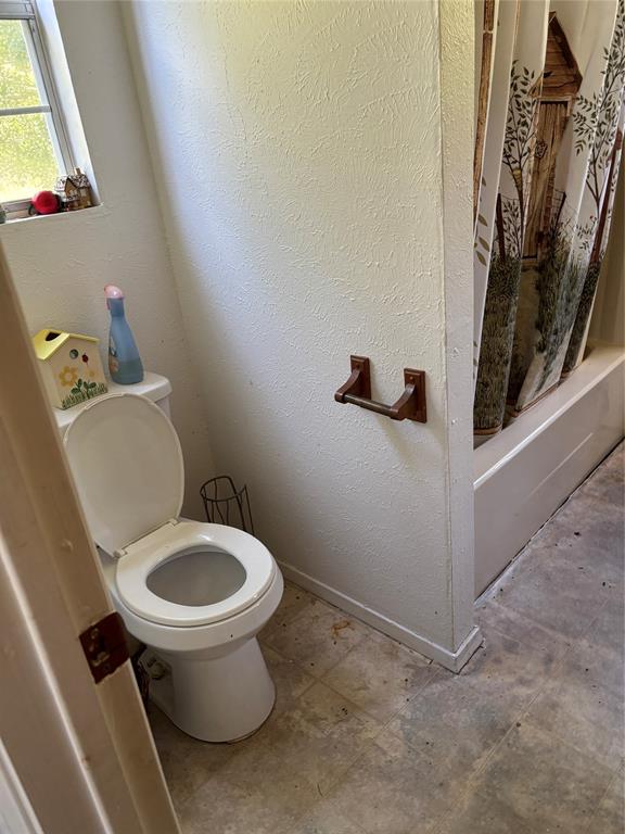 10236 County Road 2326, Unit TRACT 1 Terrell, TX 75160 - Photo 12 of 19 a bathroom with a sink and a toilet