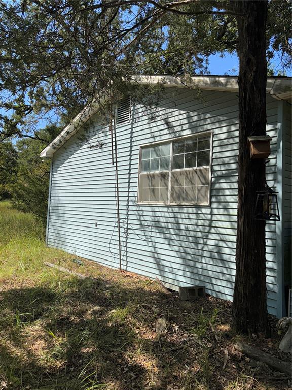 10236 County Road 2326, Unit TRACT 1 Terrell, TX 75160 - Photo 2 of 19 a view of house with backyard