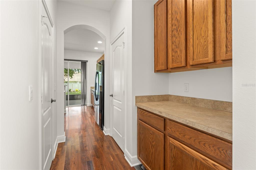 13544 Riggs Way Windermere, FL 34786 - Photo 12 of 58 a hallway with sink and wooden floor