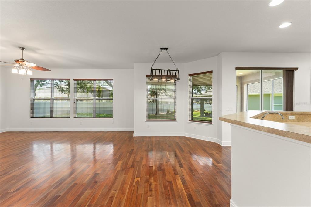 13544 Riggs Way Windermere, FL 34786 - Photo 15 of 58 wooden floor in an empty room with a window
