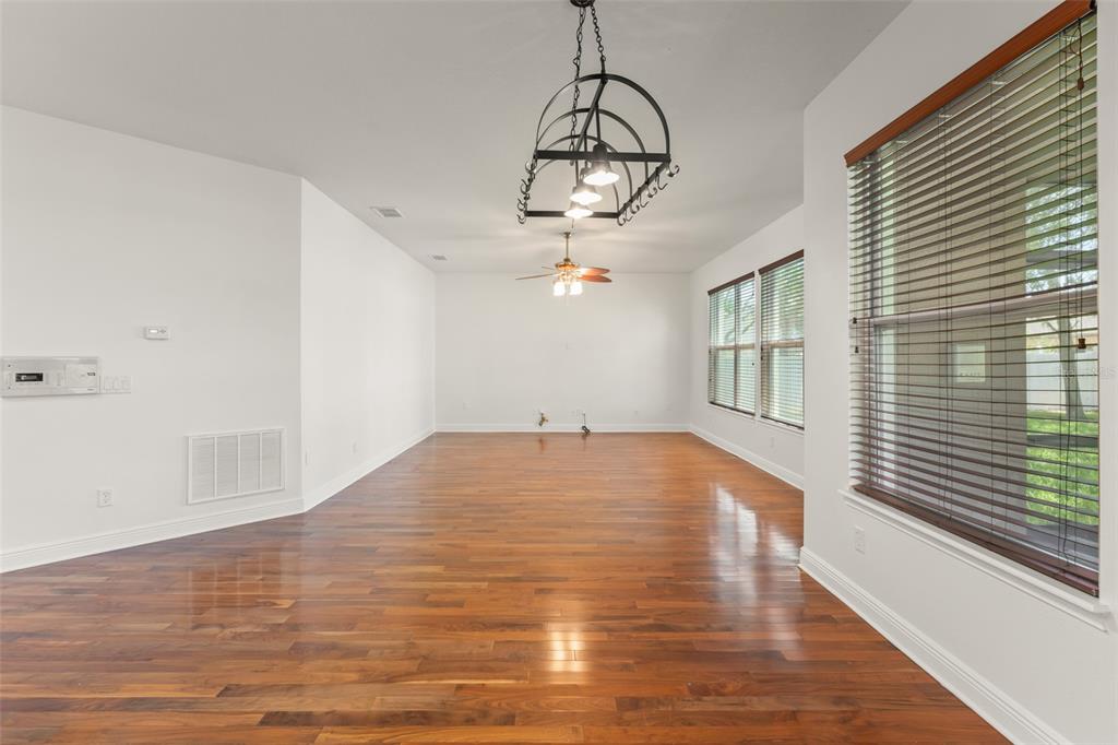 13544 Riggs Way Windermere, FL 34786 - Photo 17 of 58 a view of empty room with wooden floor and fan