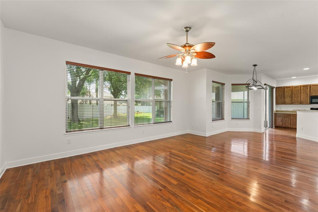 13544 Riggs Way Windermere, FL 34786 - Photo 20 of 58 a view of an empty room with window and wooden floor