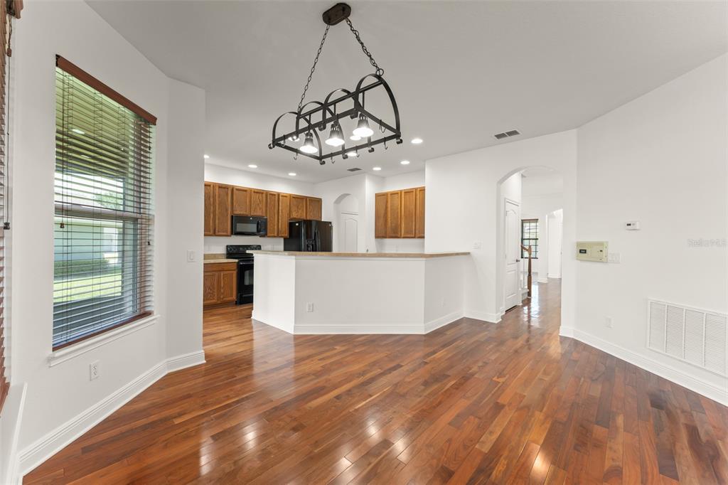 13544 Riggs Way Windermere, FL 34786 - Photo 22 of 58 a view of a kitchen with wooden floor and a window