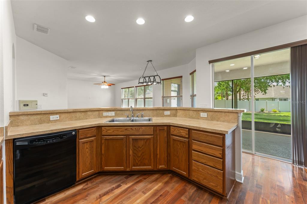 13544 Riggs Way Windermere, FL 34786 - Photo 26 of 58 a kitchen with a sink stove and cabinets