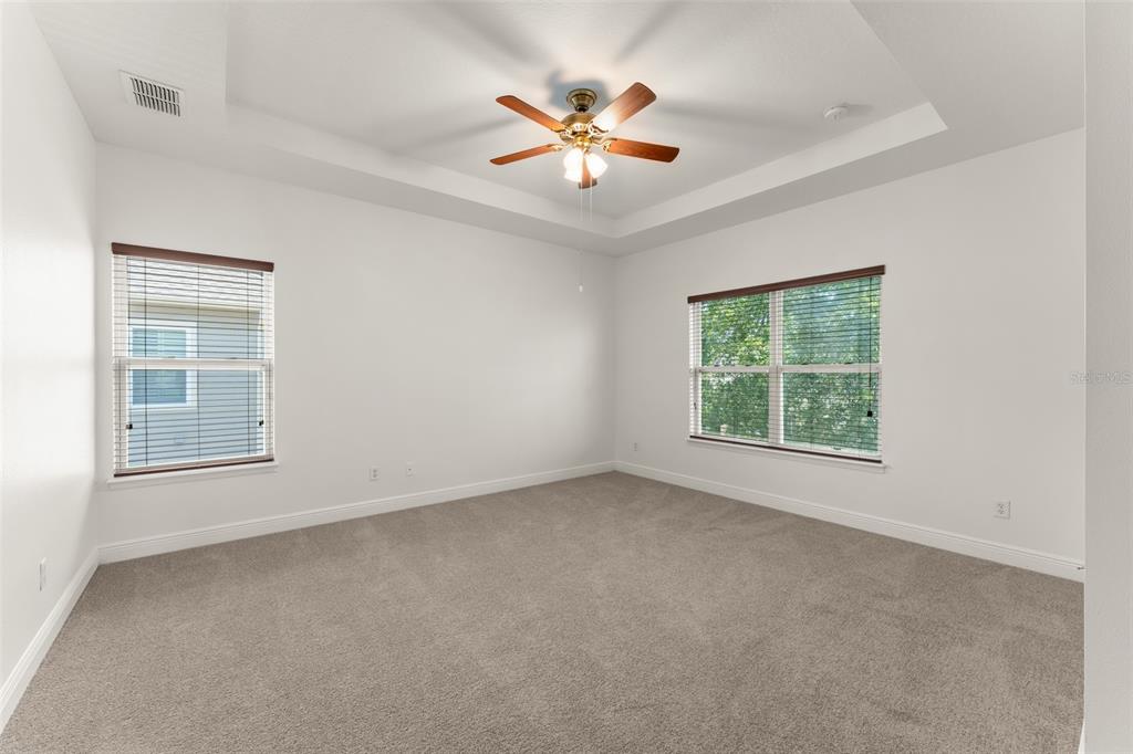 13544 Riggs Way Windermere, FL 34786 - Photo 31 of 58 an empty room with ceiling fan and window