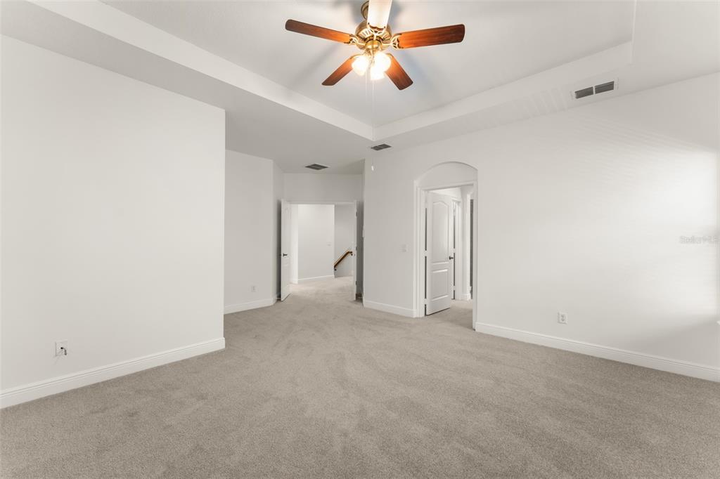 13544 Riggs Way Windermere, FL 34786 - Photo 33 of 58 an empty room with closet and a chandelier fan