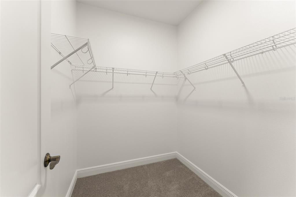 13544 Riggs Way Windermere, FL 34786 - Photo 35 of 58 a view of a room with racks on the wall