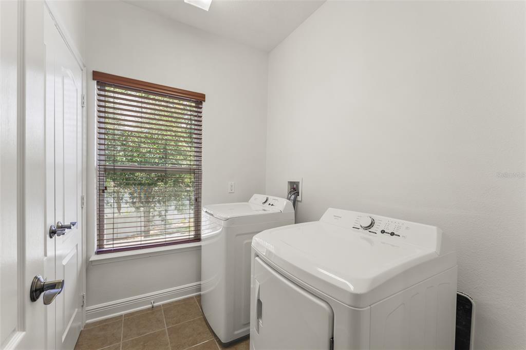 13544 Riggs Way Windermere, FL 34786 - Photo 40 of 58 a utility room with dryer and washer