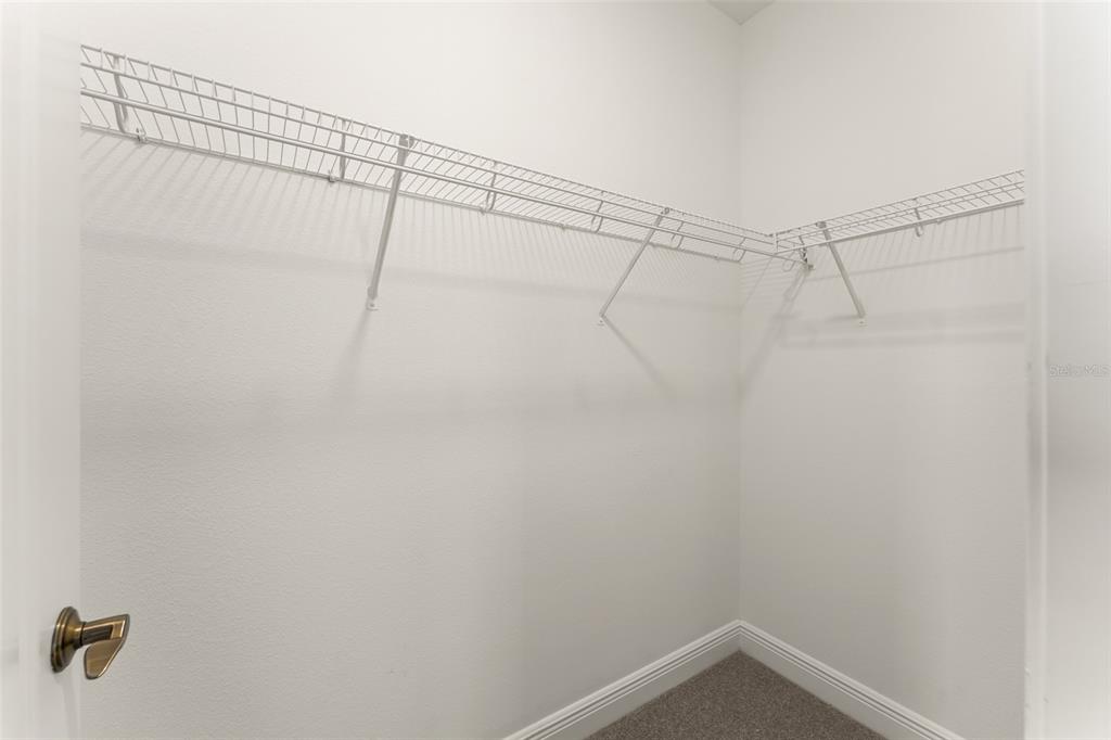 13544 Riggs Way Windermere, FL 34786 - Photo 45 of 58 a view of a room with racks on the wall