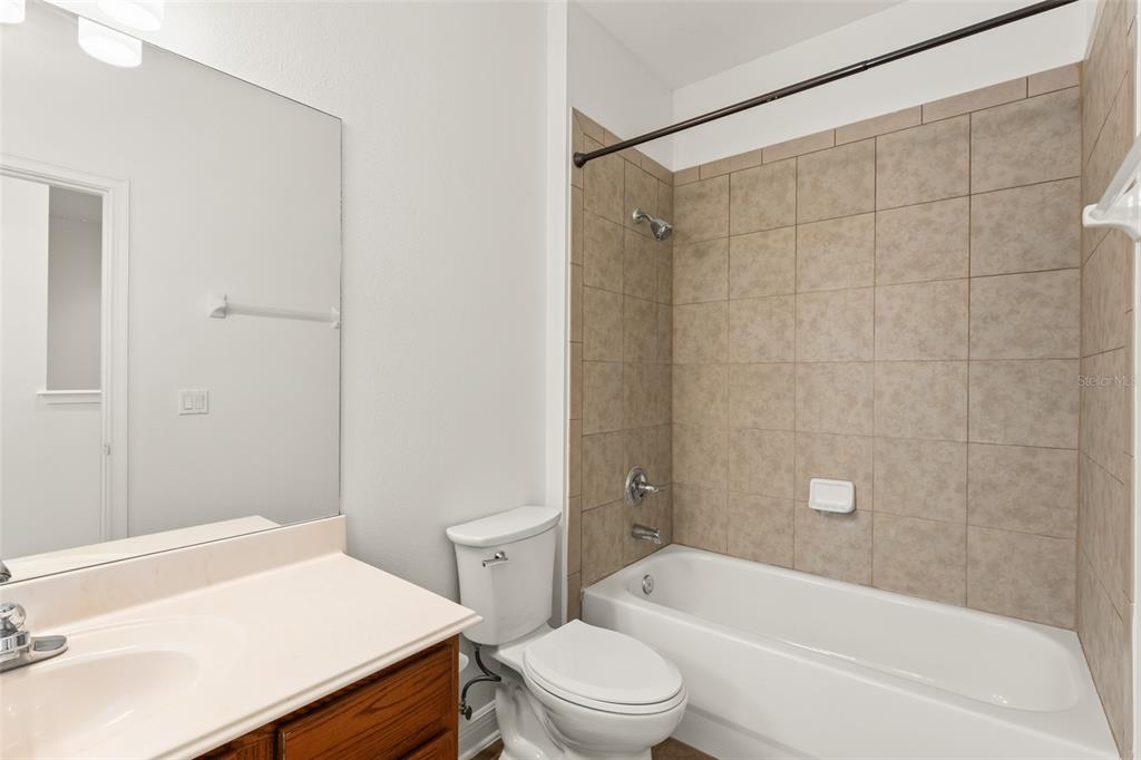 13544 Riggs Way Windermere, FL 34786 - Photo 46 of 58 a bathroom with a sink a toilet and a bathtub