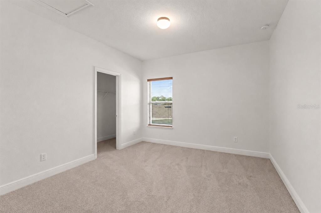 13544 Riggs Way Windermere, FL 34786 - Photo 49 of 58 a view of an empty room with a window