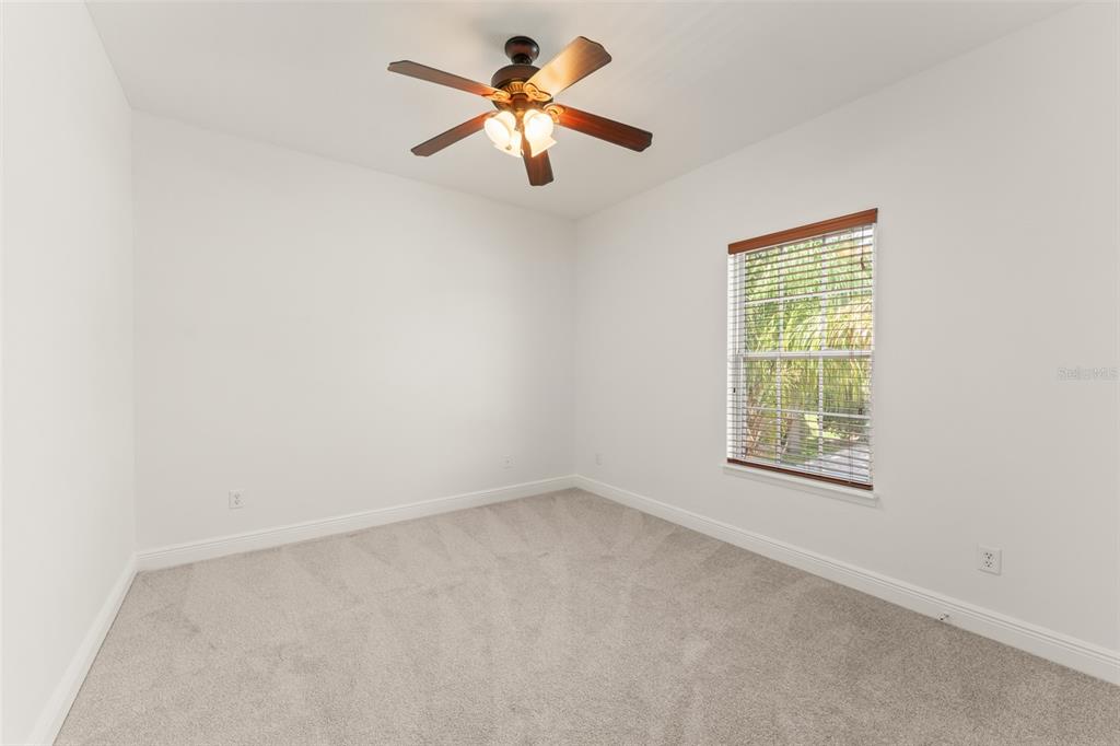 13544 Riggs Way Windermere, FL 34786 - Photo 50 of 58 an empty room with a window and a fan