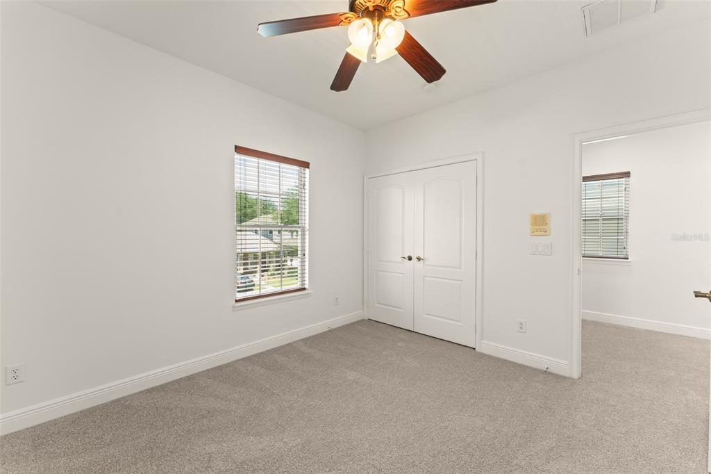 13544 Riggs Way Windermere, FL 34786 - Photo 51 of 58 a view of an empty room with chandelier fan and fire place