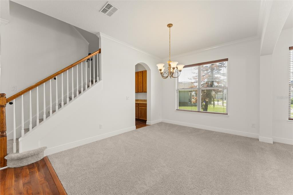 13544 Riggs Way Windermere, FL 34786 - Photo 6 of 58 a view of an empty room with chandelier fireplace and a window