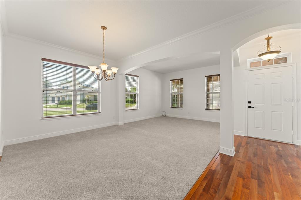 13544 Riggs Way Windermere, FL 34786 - Photo 7 of 58 a view of an empty room with window and wooden floor