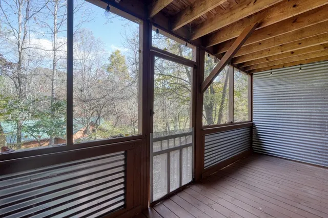 a view of outdoor space with wooden floor and stairs
