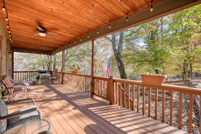 a view of porch with a large trees