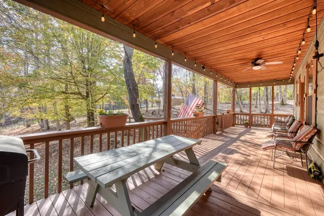 a view of a backyard with sitting area