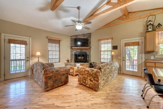 a living room with furniture fireplace and flat screen tv