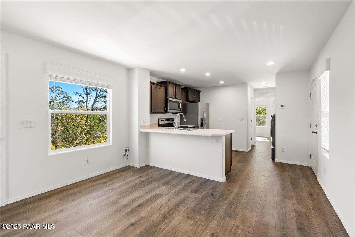1529 Private Road Prescott, AZ 86301 - Photo 4 of 25 a view of a kitchen with a sink cabinets and wooden floor