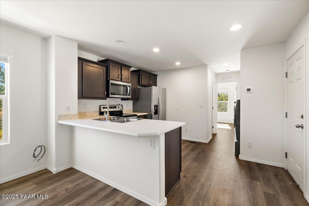 1529 Private Road Prescott, AZ 86301 - Photo 7 of 25 a kitchen with stainless steel appliances granite countertop a sink stove and refrigerator