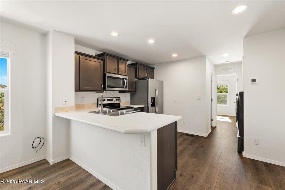1529 Private Road Prescott, AZ 86301 - Photo 8 of 25 a kitchen with stainless steel appliances a refrigerator sink and microwave
