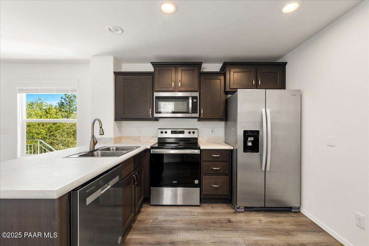 1529 Private Road Prescott, AZ 86301 - Photo 10 of 25 a kitchen with stainless steel appliances granite countertop a refrigerator and a sink