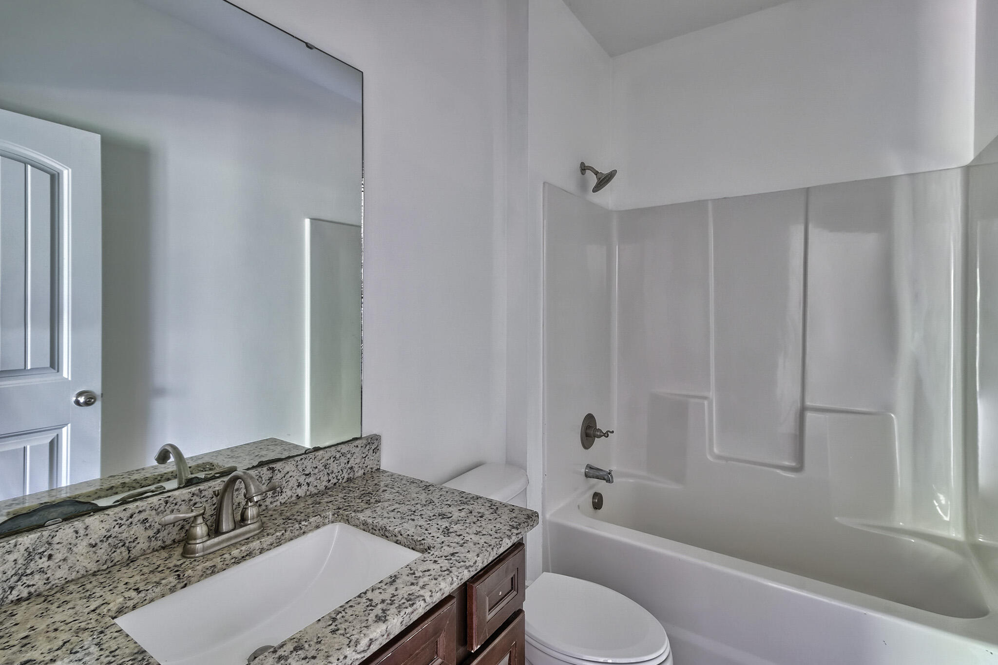 912 Goldie Road Leesville, SC 29070 - Photo 18 of 23 a bathroom with a granite countertop tub sink and mirror