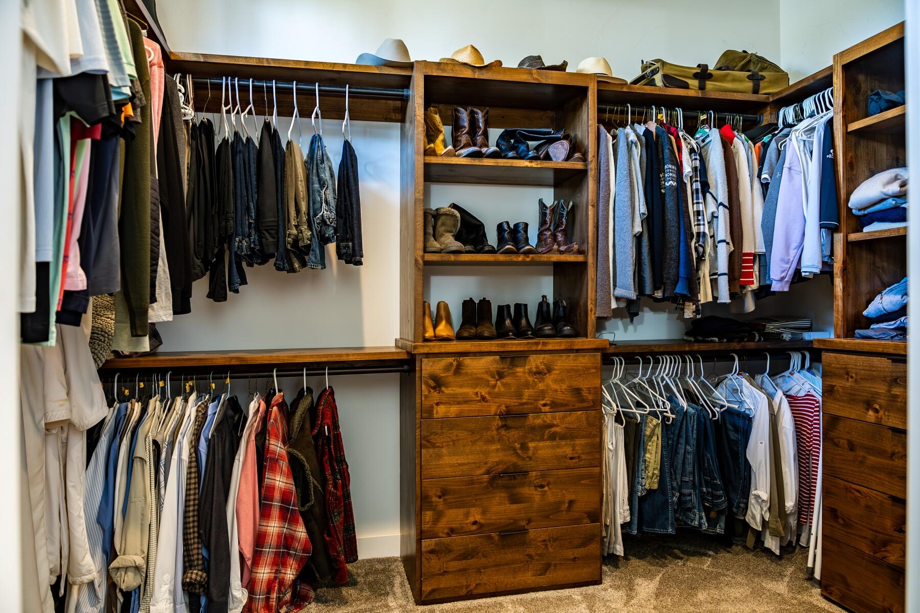 23116 Switchback Court Bend, OR 97701 - Photo 19 of 39 Master Closet with Knotty Alder Built-Ins and Abundance of Space