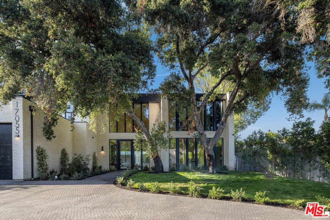 17055 Rancho Street Encino, CA 91316 - Photo 15 of 73 front view of house with a yard