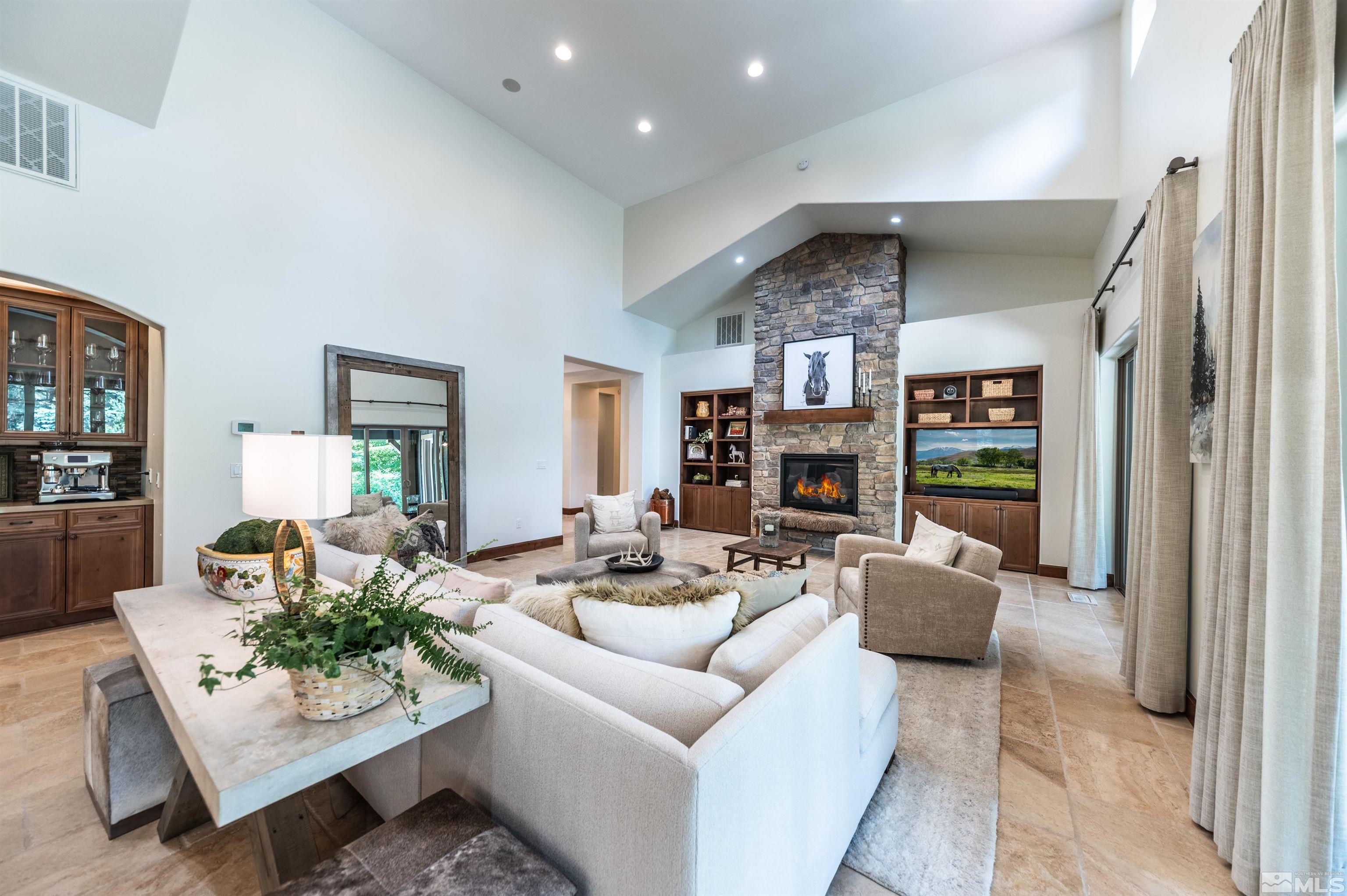 5765 Nordend Way Reno, NV 89511 - Photo 10 of 39 a living room with furniture and a fireplace