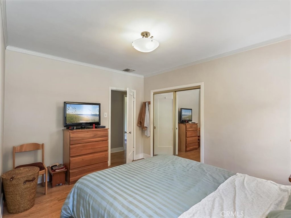 945 Rosemount Road Glendale, CA 91207 - Photo 24 of 31 a bedroom with a bed and a television