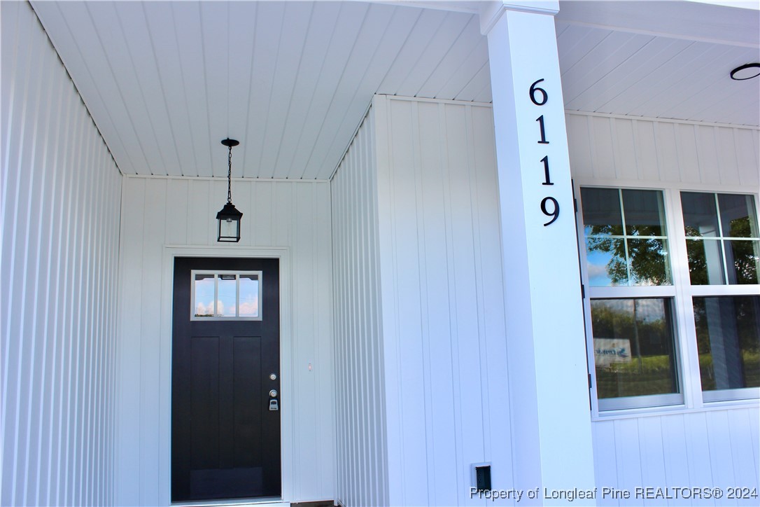 6119 Stewart Road Godwin, NC 28344 - Photo 2 of 20 a view of an entryway door