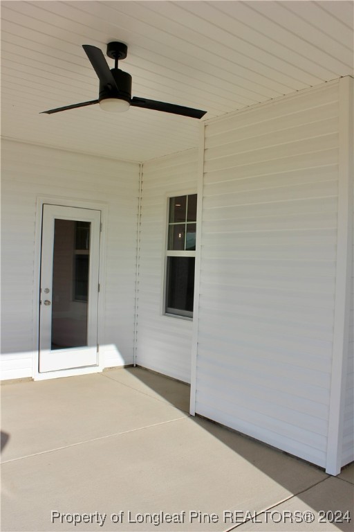 6119 Stewart Road Godwin, NC 28344 - Photo 3 of 20 a bedroom with a bed and a ceiling fan