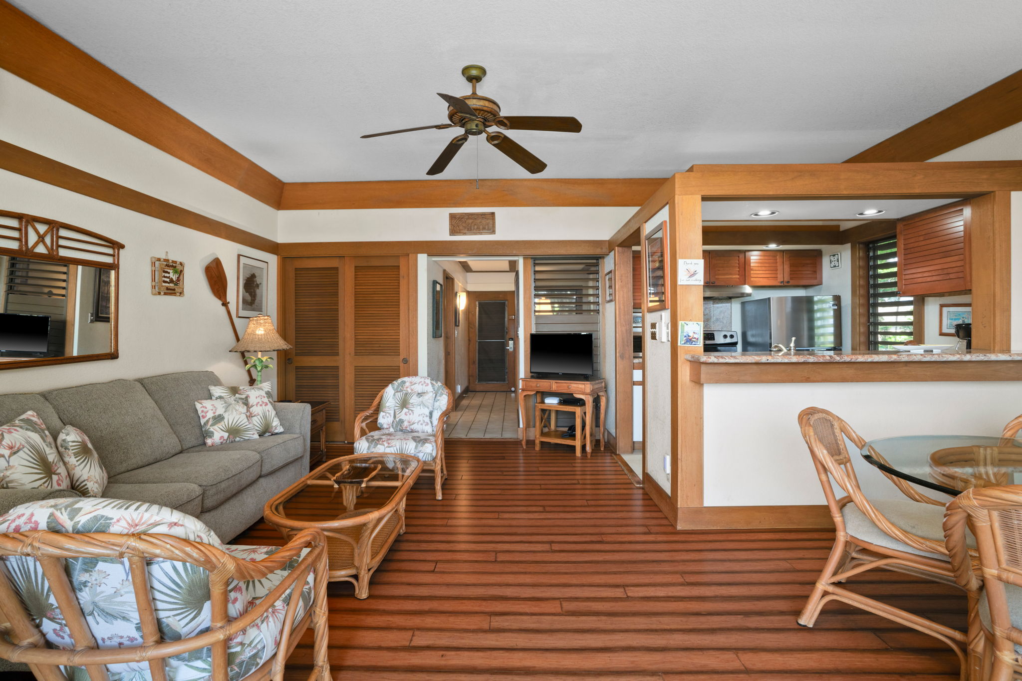 2253 Poipu Road, Unit 330 Koloa, HI 96756 - Photo 11 of 26 a living room with furniture and a wooden floor