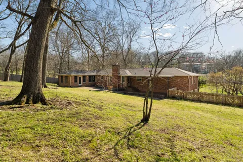 a view of a house with snow on the background