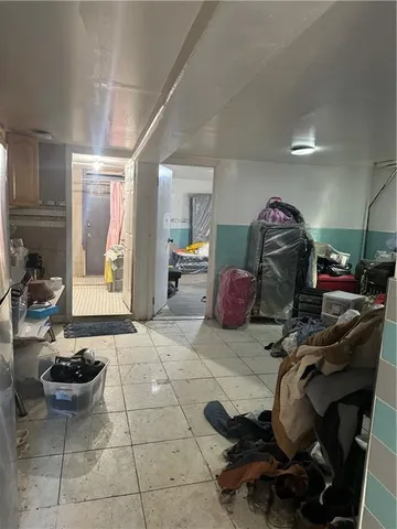 a room with furniture a gym equipment and view of living room