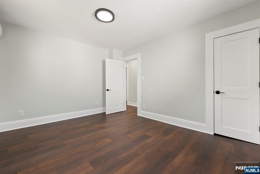 240 Berry Street Hackensack, NJ 07601 - Photo 13 of 25 a view of an empty room with wooden floor
